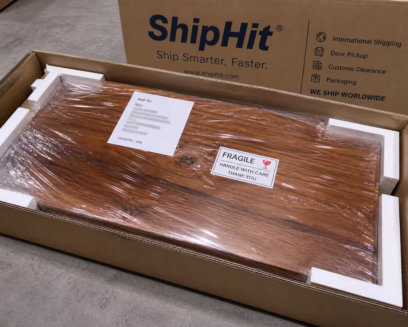 ShipHit logistics team processing a 30KG teak wood international shipment from India for express delivery to NRI customers abroad